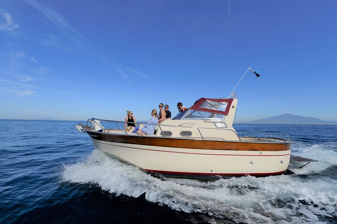 Amalfi Coast Private Boat Day Tour from Sorrento - The Gozzo Jeranto 750 setup: small boat comfort and big-coast views