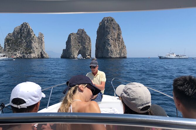 Capri Boat Tour from Sorrento - White Grotto and Faraglioni: photos, brief swims, and big-rock drama