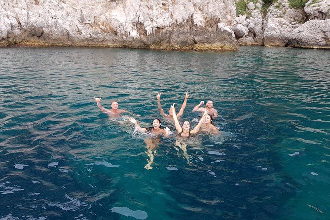 Capri Boat Tour with Optional Blue Grotto Visit from Sorrento - Faraglioni and cliffside icons: getting photos without climbing all day
