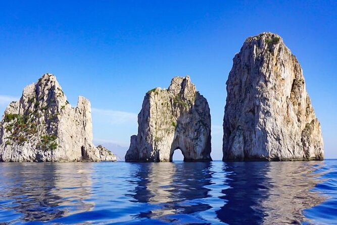 Capri Positano and Amalfi Ischia Private Boat Tour from Sorrento - Stop by stop: Grotta Rossa and the heart-in-the-rock vibe