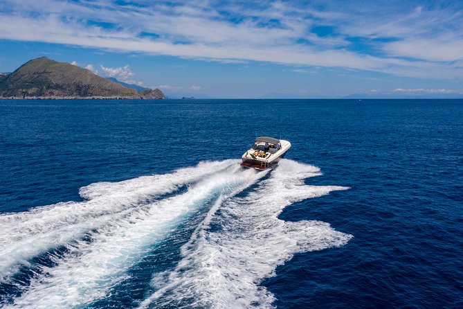 Capri & Positano Tour - Capri by boat: grottos, Faraglioni, and the “see it from the water” moment