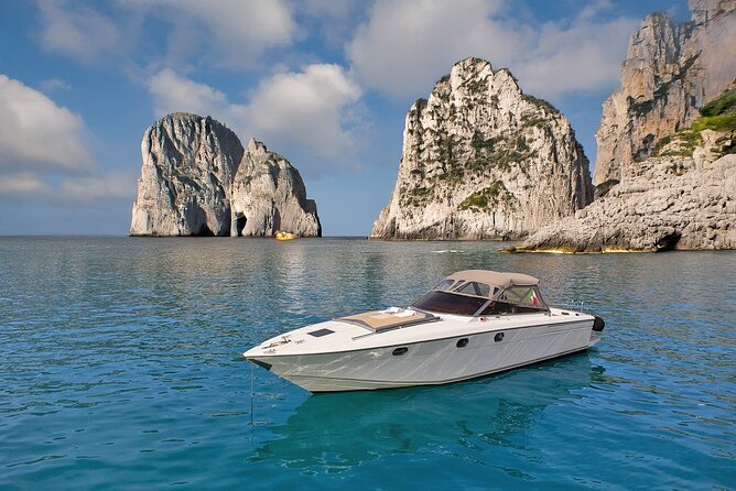 Capri Premium Boat Tour and City Visit Free Bar and Aperitif - Punta Carena lighthouse and the Faraglioni photo moment