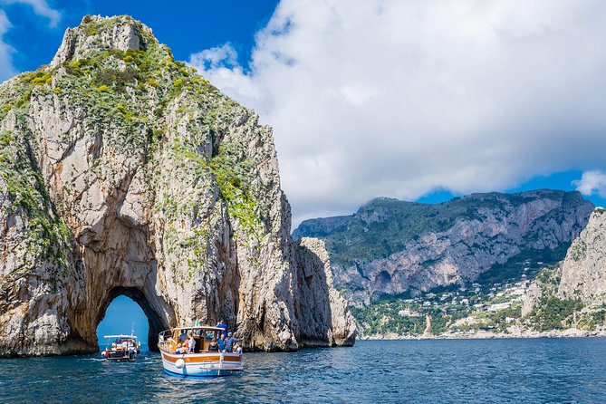 Capri Private Boat Tour from Sorrento, Positano or Naples - Marina Piccola and the Faraglioni sea stacks, with a pass through the hole