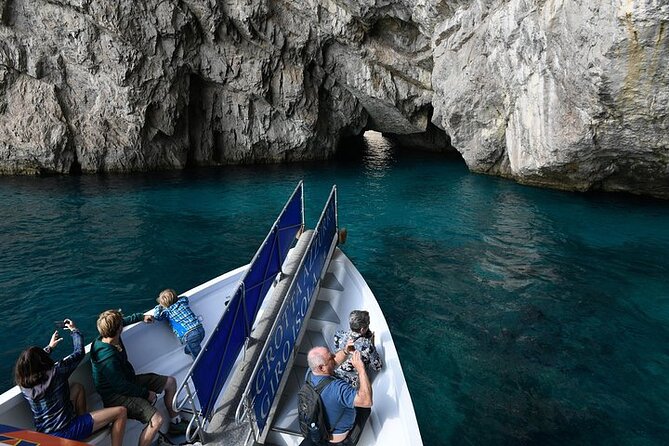Full-Day Guided Boat Tour to Capri from Sorrento with Limoncello - Sailing Highlights: Faraglioni Arch, Villa Curzio Malaparte, and the Grotto Views