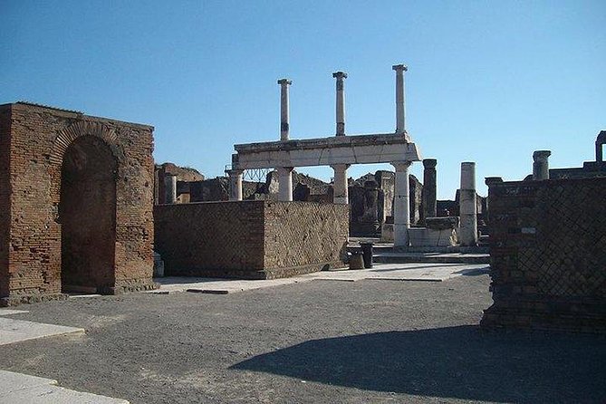 Guided Tour of Pompeii and Herculaneum with Lunch and Ticket - Pompeii walk sequence: Via dell’Abbondanza, Stabian Baths, and a real brothel