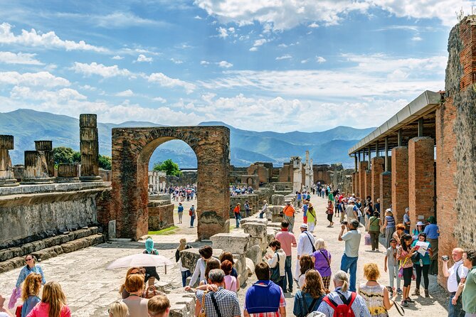 Guided Tour of Pompeii and Herculaneum with Lunch and Ticket - Pompeii essentials fast: Forum, Jupiter, and the city market