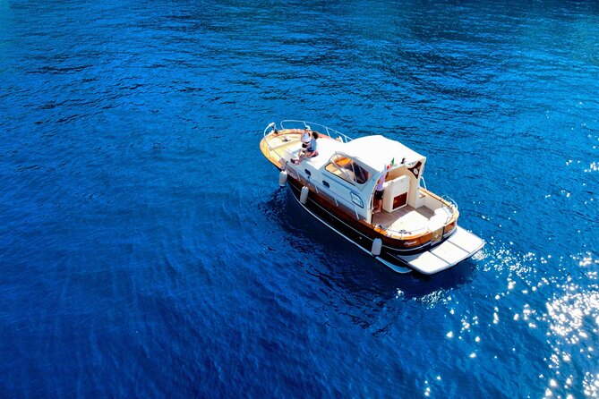 Luxury private boat tour to Capri and Blue Grotto on Gozzo 32 ft - 3 hours on Capri island: beaches, alleys, and lunch on your terms
