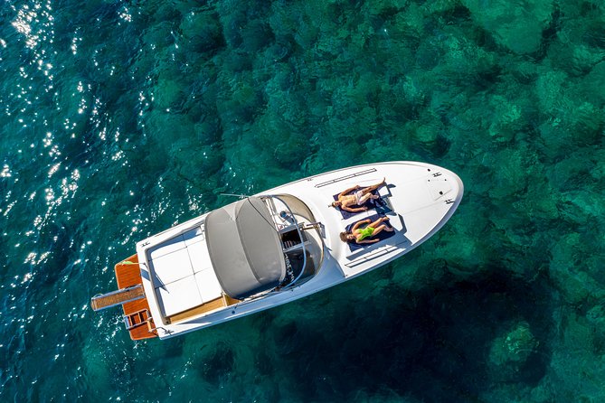 One Day Private Boat Tour of Capri - Capri by sea: grottos, cliffs, and Faraglioni moments