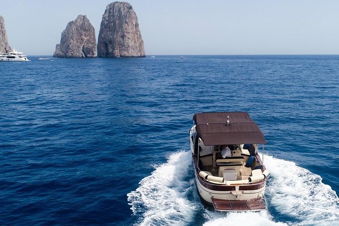 Private Scenic Boat Tour from Sorrento to Capri and Positano - Capri From the Water: Blue Grotto Chances, White Grotto Views, and Faraglioni Luck