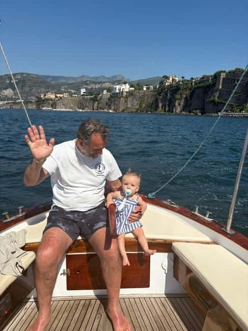 Sorrento: Boat Coastal Cruise with Swim and Limoncello - Getting onboard at Marina Grande, Cooperativa Azzurra style
