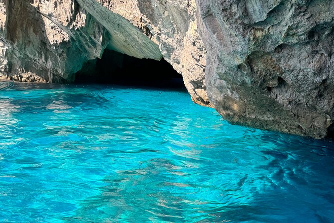 Sorrentomaxiboat tours to Capri - On-board perks: drinks, water, and that small-boat atmosphere
